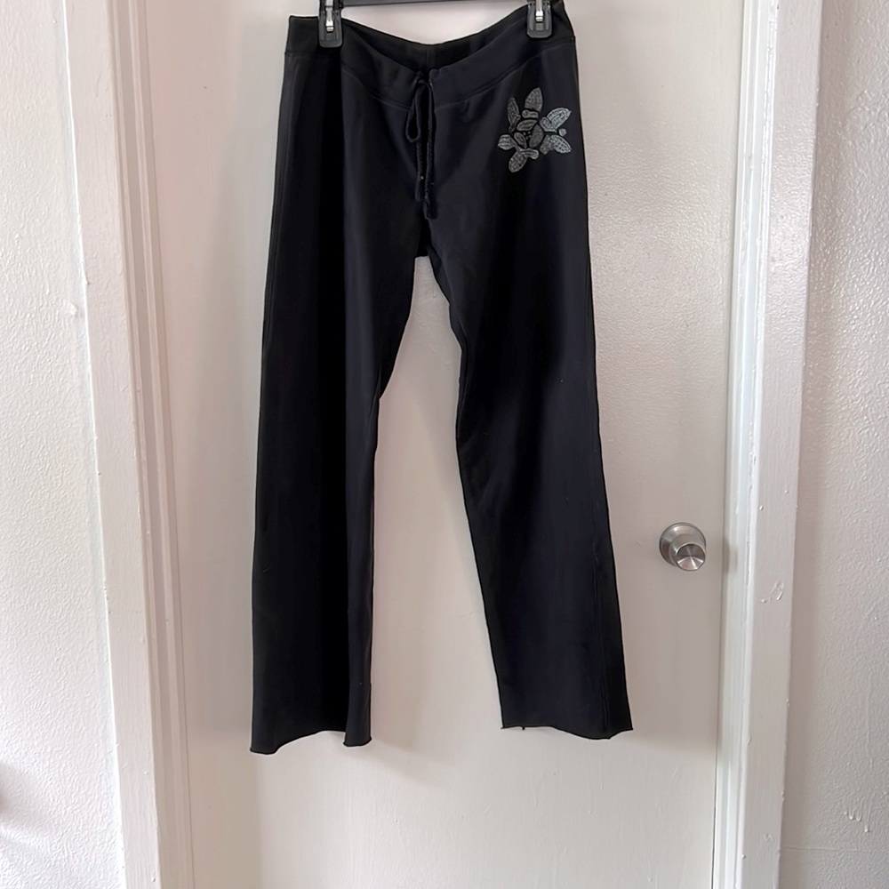Lucky Brand black wide leg sweat pant with silver flower embroidered.